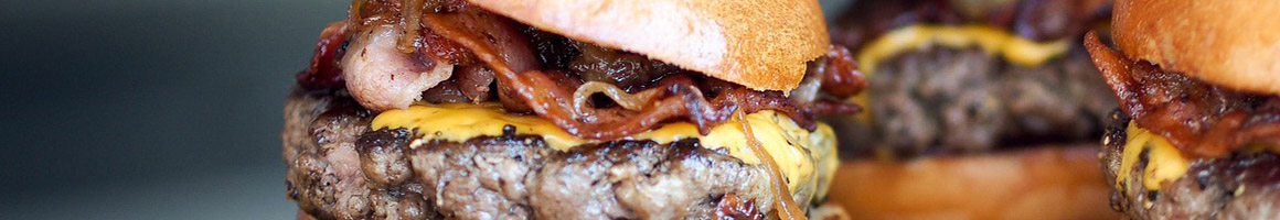 Eating Burger at Jimbos Hamburger Palace restaurant in New York, NY.